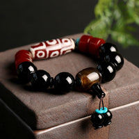 KarmaRipples tibetisches Neun-Augen-Dzi-Perlen-Armband aus schwarzem Onyx zum Schutz des Reichtums