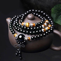 KarmaRipples 108 Perlenstickereien – authentisches Mala-Armband aus schwarzem Obsidian und Tigerauge