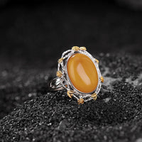 KarmaRipples verstellbarer Ring mit 990er Sterlingsilber und Bernstein-Fokus
