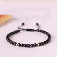 KarmaRipples kleines schwarzes Obsidian-Perlen-Erfüllungsseilarmband