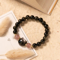 KarmaRipples Armband mit Perlenstickerei aus schwarzem Obsidian und Erdbeerquarz, silberglänzendem Obsidian und Katzenkopf