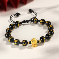 KarmaRipples Armband mit roter Achatperle und schwarzem Onyx, Bronze, Jahr der Schlange, Fu-Zeichen, Om Mani Padme Hum, Glücksarmband