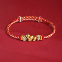 KarmaRipples gewebtes Armband aus 999er Sterlingsilber mit Farbverlauf und roter Schnur zum Jahr der Schlange
