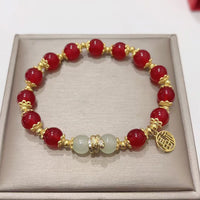 KarmaRipples Armband „Jahr der Schlange“ aus rotem Achat und Jade mit Fu-Charakter 