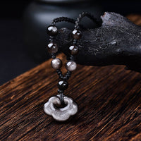 KarmaRipples authentische Halskette mit Anhänger aus silberglänzendem Obsidian mit glückverheißenden Wolken, Schutz und Beruhigung