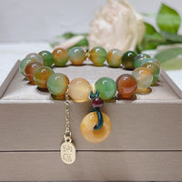 KarmaRipples Nafu Balance-Armband mit Pfauenachat-Topas und Peace-Schnalle