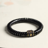KarmaRipples tibetisches Kokosnussschalen-Armband mit glückverheißenden Wolken