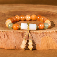 KarmaRipples Armband aus goldener Seide, Jade, Perlenstickerei, Kürbis und Elfenbein-Edelstein