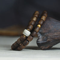 KarmaRipples 999 Gold Seltenes Tarakan Adlerholz Tibetischer Alter Geist Knochen Balance Stärke Doppelwickelarmband