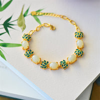 KarmaRipples Schutzarmband aus elfenbeinfarbener Jade und Cyan-Jade mit Lotusblüte