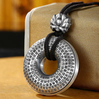KarmaRipples Halskette mit Anhänger aus 999er Sterlingsilber mit Herz-Sutra-Lotus-Friedensschnalle