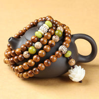 KarmaRipples tibetisches Rosenholz-Lotus-Mala-Armband mit Schutz- und Ruheanhänger