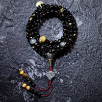 KarmaRipples 108 Mala-Perlenarmband mit Goldglanz, Obsidian, Tigerauge, Adlerauge, Stein, Reichtum