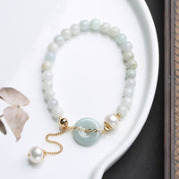 KarmaRipples authentisches Jade-Perlen-Armband mit Friedensschnalle und Wohlstandssymbol