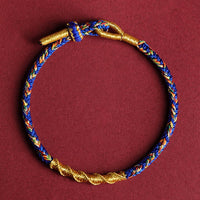 Handgefertigtes Armband aus gewebten Schnüren mit dem chinesischen Tierkreiszeichen Buddha