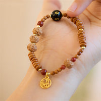 KarmaRipples tibetisches Bodhi-Samen-Armband mit schwarzem Onyx und Rauchquarz, Om Mani Padme Hum Fu-Charakter, Reichtum