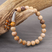 KarmaRipples Armband „Om Mani Padme Hum“ aus verwittertem Stein