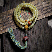 KarmaRipples 108 Mala-Perlenarmband aus tibetischem Schafshorn und Bernstein