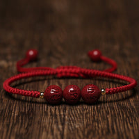KarmaRipples handgefertigtes, gewebtes Armband mit Perlenstickerei und Om Mani Padme Hum-Gravur