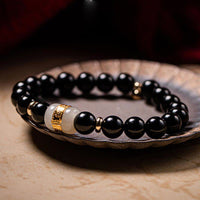 KarmaRipples Magnetarmband „Om Mani Padme Hum Strength“ aus schwarzem Obsidian und Jade