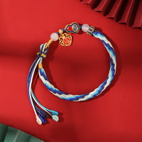 KarmaRipples handgefertigtes Armband aus 925er Sterlingsilber mit Kürbis-Segensschnur und Reinkarnationswebung