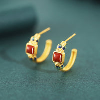 KarmaRipple's Ohrstecker aus 925er Sterlingsilber mit rotem Achat und Lotusmotiv „Confidence Calm“