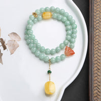 KarmaRipples Armband aus 925er Sterlingsilber mit echtem Jade- und Bernstein-Schmetterling und Glücksbringer
