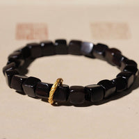 KarmaRipples Armband „Peace Calm“ aus tibetischem Ebenholz mit quadratischen Perlen