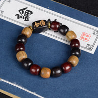 KarmaRipples mehrfarbiges Peace-Armband aus grünem Sandelholz, Ebenholz und rotem Sandelholz