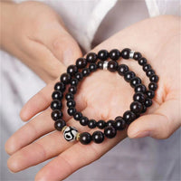 KarmaRipples Tibetisches Ebenholz-Dzi-Perlen-Balance-Doppelwickelarmband