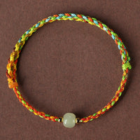 KarmaRipples farbenfrohes Seil-Armband mit Glücks-Jadeperlen