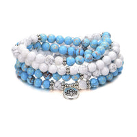 KarmaRipples 108 Mala-Perlenarmband mit elfenbeinfarbenem, türkisfarbenem Kaiserstein und Lotus-Segen