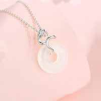 KarmaRipples Halskette mit Anhänger „Jahr der Schlange“ aus 925er Sterlingsilber mit Chalcedon und Peace-Schnalle