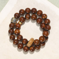 KarmaRipples authentisches tibetisches, lila-goldenes Ratten-Bodhi-Samen-Reichtumsarmband mit doppelter Wicklung