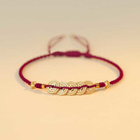 KarmaRipples geflochtenes Armband mit Bronzemünze „Glücksbaum“ und Glücksstärke