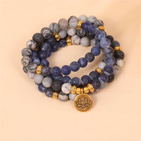 KarmaRipples 108 Mala-Armband mit Perlen, Sodalith, Zebra-Jaspis, Edelstein, Lotus-Stärke