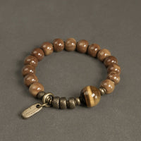 KarmaRipples Armband mit Kuka-Samen, Tigerauge, Goldglanz, Obsidian und Bronze, Reichtum und Glück