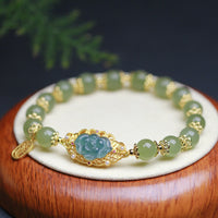 KarmaRipples 14 Karat vergoldetes 925er Sterlingsilber-Lotus-Glücksarmband aus Hetian-Jade
