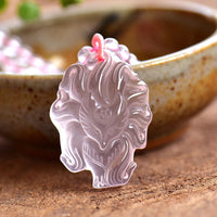 KarmaRipples authentische Halskette mit Liebesanhänger mit rosa Edelstein und neunschwänzigem Fuchs