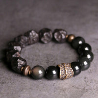 KarmaRipples Kraftpaar-Armband aus schwarzem Obsidian, Ebenholz und Bronze