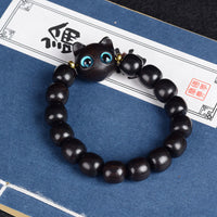KarmaRipples Balance-Armband aus Ebenholz, grünem Sandelholz und rotem Sandelholz mit hübscher Katze