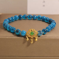 KarmaRipples blaues Candy-Achat-Talisman-Ausgleichsarmband mit chinesischem Schloss