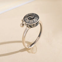 KarmaRipples drehbarer Yin-Yang-Ring aus Bronze mit Glückssymbol